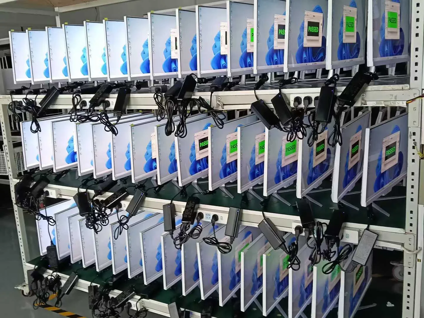 Computers undergoing testing on organized racks